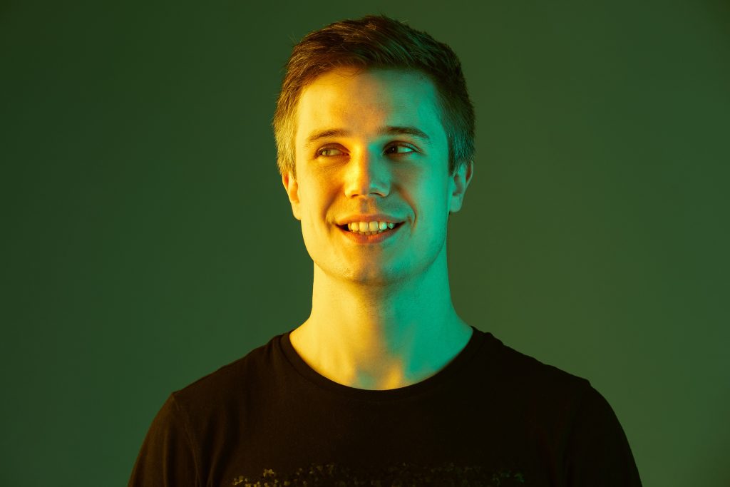 young man smiling with neon light 1